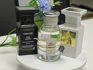 Flacon original Tom Ford Oud Wood face à son alternative intense de qualité laboratoire par Imixx